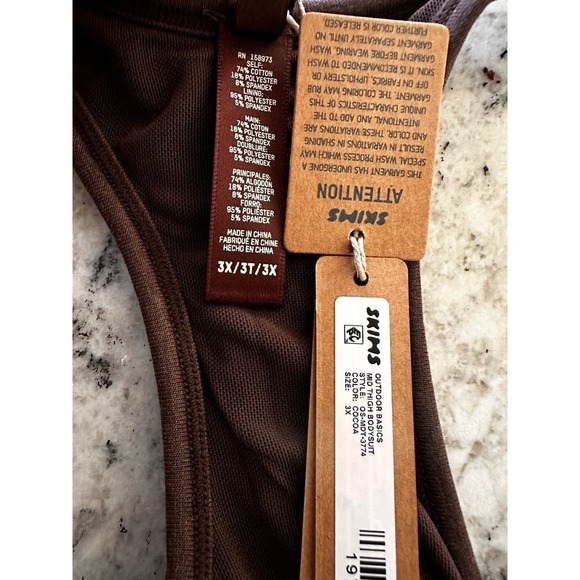 SKIMS OUTDOOR BASICS
MID THIGH BODYSUIT COCOA 3X - Picture 9 of 9